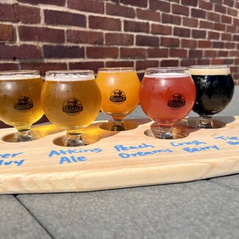 Textile TapHaus - five different types of beer on a wooden tray - Beer Bar Near Me - Atkins, Iowa Textile TapHaus - five different types of beer on a wooden tray - Beer Bar Near Me - Atkins, Iowa