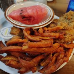 Shady Rest Family Restaurant - Fried flounder, sweet potato fries, watermelon, hush puppies under the fries.