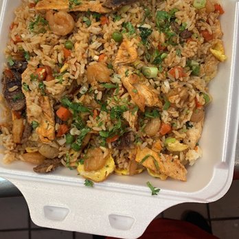 Cumbia Cafe - a take out container of rice and vegetables - Colombian Near Me - Kearny, New Jersey