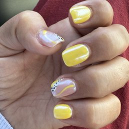 Acrylic nails, round, short and with chrome finish. Also special design on ring and thumb nails.
