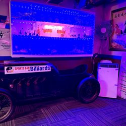 89 Sports Bar & Billiards - 89 billiard main entrance. Really cool vintage go kart and neon display.