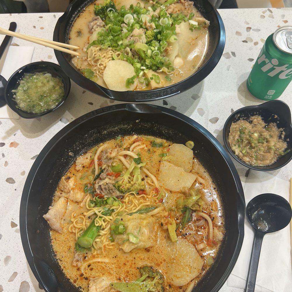Our humongous bowls (we were so hungry) with spicy beef broth. My bowl in the front was $23 Our humongous bowls (we were so hungry) with spicy beef broth. My bowl in the front was $23