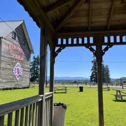picnic tables and a barn