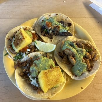 Tacos Chukis - Tacos- asada (top right), pollo (bottom right), and adobada pork (with pineapple) - Tacos Near Me - Seattle, Washington Tacos Chukis - Tacos- asada (top right), pollo (bottom right), and adobada pork (with pineapple) - Tacos Near Me - Seattle, Washington
