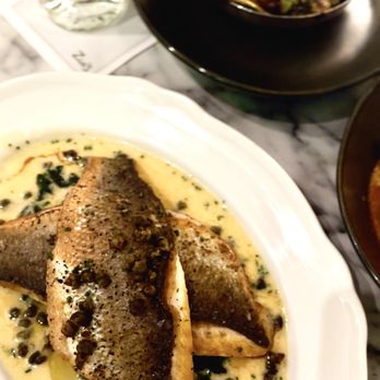 Zio's - Branzino Piccata with lemon caper sauce and wilted spinach - Italian Near Me - Las Vegas, Nevada