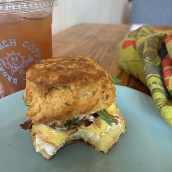 Broad Porch Coffee - Biscuit with egg, bacon, basil, sun-dried tomatoes, and dressing. - Coffee & Tea Near Me - Luray, Virginia Broad Porch Coffee - Biscuit with egg, bacon, basil, sun-dried tomatoes, and dressing. - Coffee & Tea Near Me - Luray, Virginia