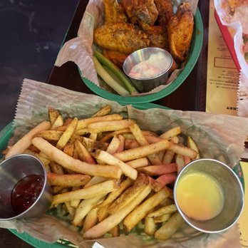 Kush Brickell - Buffalo chicken with lemon pepper sprinkle and fries - Bars Near Me - Miami, Florida Kush Brickell - Buffalo chicken with lemon pepper sprinkle and fries - Bars Near Me - Miami, Florida