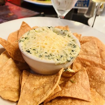 Pujo St Cafe - a plate of tortilla chips and a glass of wine - Cafes Near Me - Lake Charles, Louisiana Pujo St Cafe - a plate of tortilla chips and a glass of wine - Cafes Near Me - Lake Charles, Louisiana