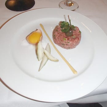 Le Bistro - “Bison & Filet Mignon Tartare” with caper, Dijon sauce, organic egg yolk and housemade pickles - French Near Me - Lighthouse Point, Florida Le Bistro - “Bison & Filet Mignon Tartare” with caper, Dijon sauce, organic egg yolk and housemade pickles - French Near Me - Lighthouse Point, Florida