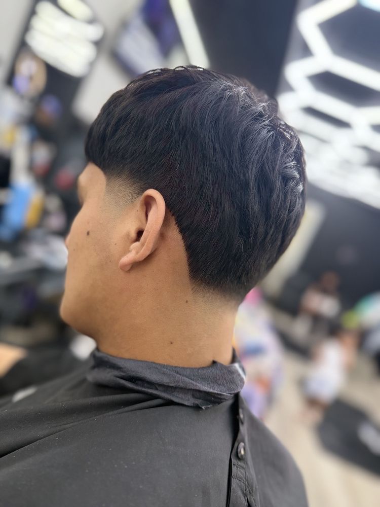 Xclusive Barbershop Logo