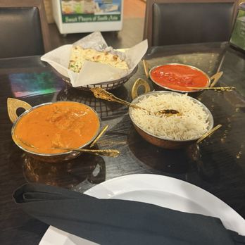 Taj Cafe - Butter chicken & Chicken Coconut Masala w/ white rice and Garlic Naan - Indian Near Me - Fontana, California Taj Cafe - Butter chicken & Chicken Coconut Masala w/ white rice and Garlic Naan - Indian Near Me - Fontana, California