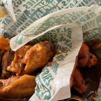 Wingstop - Four mild on left and four hot on the right. - Chicken Wings Near Me - Texas City, Texas