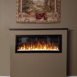 Thompson Stone and Marble - This is the finished product of my electric fireplace. Thompsons did the granite mantel and it is perfect. Highly recommend their service
