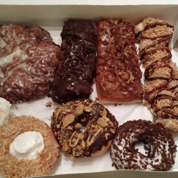 Donut King - Top: apple fritter, death by chocolate, maple bacon, Samoas. Bottom: key lime, coconut cream, Nutter Butter, devil's food cake. - Donuts Near Me - Winter Park, Florida