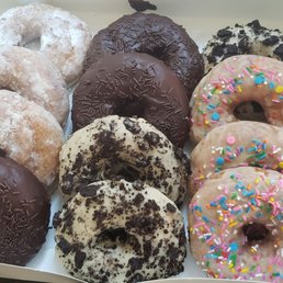 Dozen donuts - Powdered sugar, chocolate with sprinkles,  oreo, vanilla with sprinkles