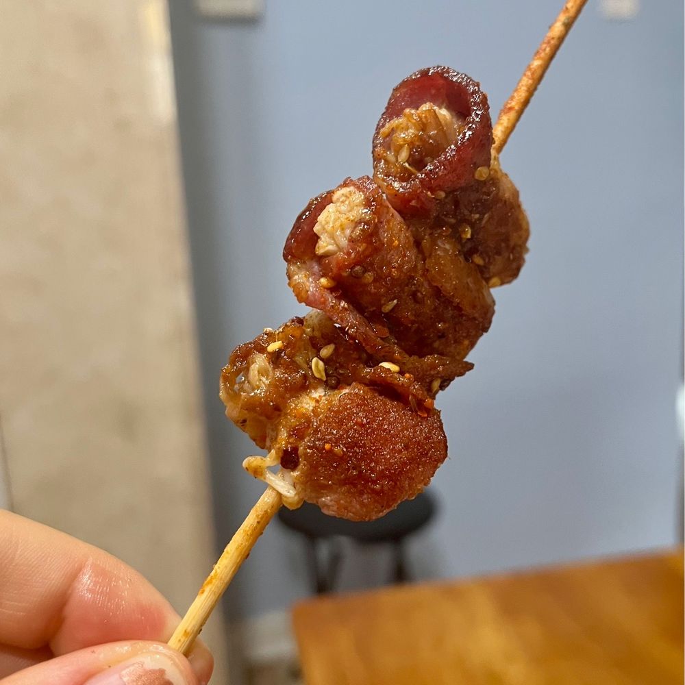 Magic Noodles - Bacon wrapped shroomies at "Less Spicy" spice level. So cute and exploding w/ flavor!! - Noodles Near Me - Philadelphia, Pennsylvania