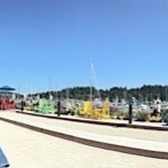 The Cabana - Panoramic photo of the outdoor seating area and bocce ball courts - Fish & Chips Near Me - Anacortes, Washington