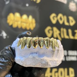 Port Charlotte Gold and Pawn - We make gold grillz and custom jewelry! Visit our website for gold grillz price list. Thank you PCG&P