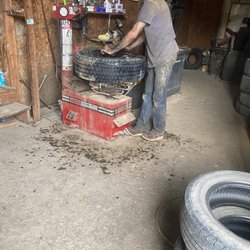 Country Boy's Tire & Auto Repair LLC - That's Jeremy looking for the hole?