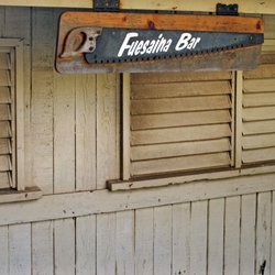 Damien Tours - Fuesaina's Bar original bar sign, gifted to the owner.  Bar sign is located on the right side of the entrance to the bar.