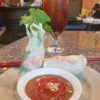 Pho Ton - Shrimp spring rolls and iced tea. Sriracha was added by me. - Vietnamese Near Me - Houston, Texas
