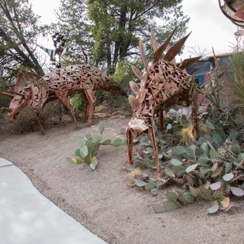 Spaceship UFO House - Dinosaurs in front of spaceship house - Architectural Tours Near Me - Albuquerque, New Mexico