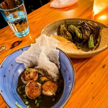Water Street Kitchen - two plates of food on a wooden table - Bars Near Me - Woods Hole, Massachusetts