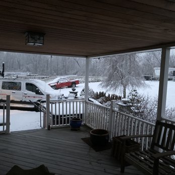 Mikes Remodeling - a view of a snow covered porch - General Contractors Near Me Mikes Remodeling - a view of a snow covered porch - General Contractors Near Me
