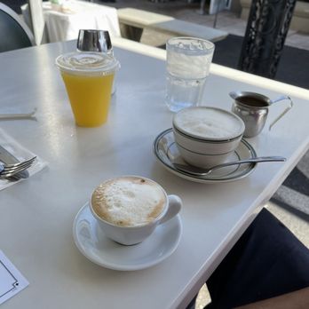 Versailles - Leche evaporada cortadito, oj, café con leche - Cuban Near Me - Miami, Florida Versailles - Leche evaporada cortadito, oj, café con leche - Cuban Near Me - Miami, Florida