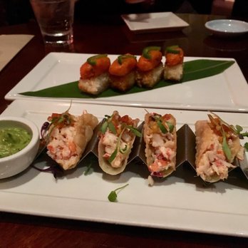 Koi Restaurant - Lobster tacos in front, crispy rice topped with spicy tuna in back - Sushi Bars Near Me - New York, New York