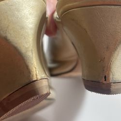Jack's Shoe Repair - He was supposed to fix this. Heel pads aren't even sitting flush with the bottom of the shoe.