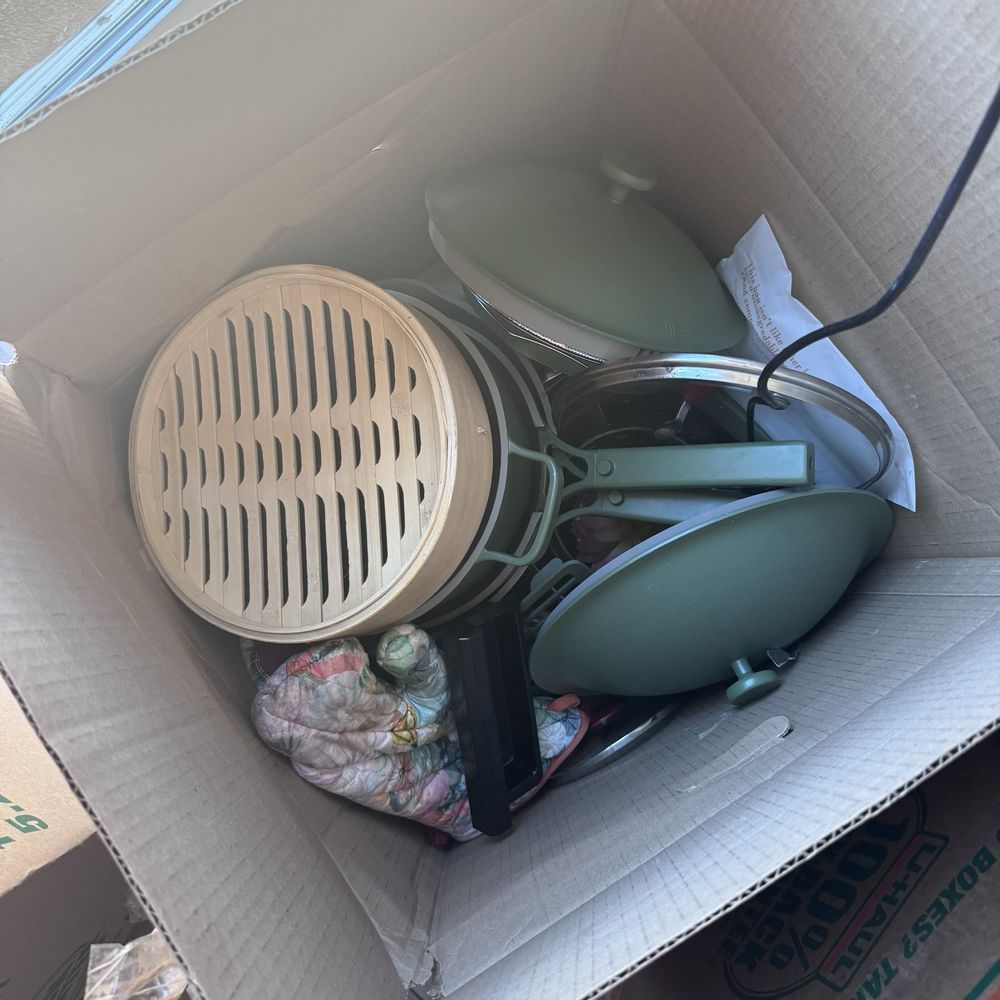 Our place pans thrown in a box Our place pans thrown in a box