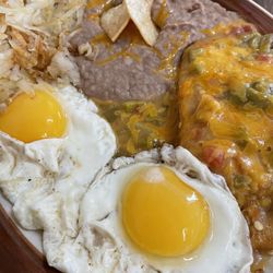 Garcia's Sunset Grille - Carlos' special.  1 tamale with green chili, beans, hash brown and eggs