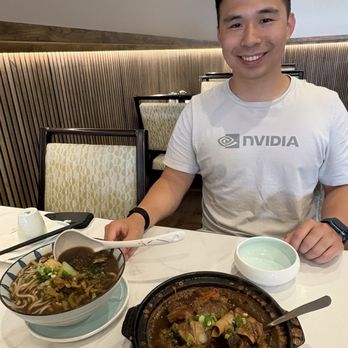 Hakka House - Taiwanese beef noodle soup (left) and Braised beef tendon and beef brisket (right). Happy customer in the back - Taiwanese Near Me - Redmond, Washington