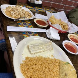 Tamale, Taco with Rice. Chicken with queso and rice. Tamale, Taco with Rice. Chicken with queso and rice.
