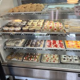 Just some of the amazing pastries here - the cannolis are filled in back and yes, please ALL the Powdered sugar, please!!! Just some of the amazing pastries here - the cannolis are filled in back and yes, please ALL the Powdered sugar, please!!!