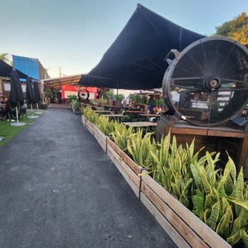 Coco Market - a row of planters with plants in them - Fruits & Veggies Near Me - Miami, Florida Coco Market - a row of planters with plants in them - Fruits & Veggies Near Me - Miami, Florida