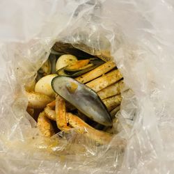 Rock & Toss Crab House - Crab legs, green mussels, boiled egg, etc. delicious with garlic sauce.