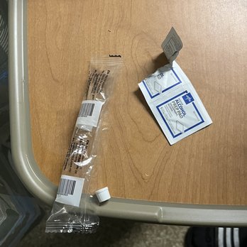 Mount Sinai South Nassau - Nurse left wrappings on tray table after changing IV plugs - Hospitals Near Me - Oceanside, New York