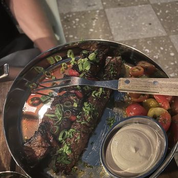 Laser Wolf - Left: steak kebab, right: brisket kebab. Came with tomatoes and tahini - Middle Eastern Near Me - Brooklyn, New York