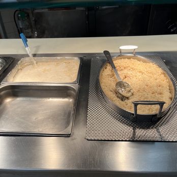 City Cafe - two pans of food on a counter - Food Court Near Me - Houston, Texas