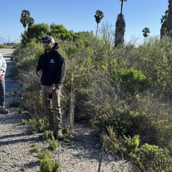 Los Cerritos Wetlands - Chris talking about how plants in the marshes need different levels of water saturation. Behind him are mule fat trees,