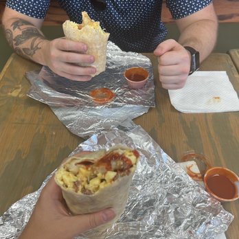 Shark bite - a man eating a burrito at a restaurant - Breakfast & Brunch Near Me - Fort Walton Beach, Florida Shark bite - a man eating a burrito at a restaurant - Breakfast & Brunch Near Me - Fort Walton Beach, Florida