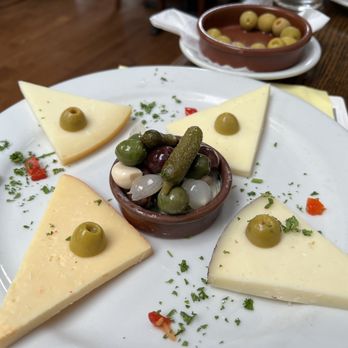 Costa Brava - 5 Spanish Cheeses- the blue is hidden under the olives. Tablas de Quesos Espanoles - Tapas Bars Near Me - San Diego, California Costa Brava - 5 Spanish Cheeses- the blue is hidden under the olives. Tablas de Quesos Espanoles - Tapas Bars Near Me - San Diego, California