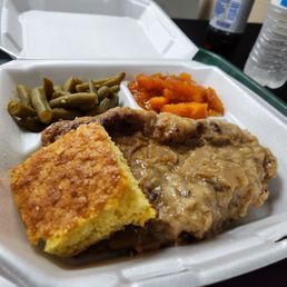 Smothered Pork Chop, yams, green beans, and cornbread Smothered Pork Chop, yams, green beans, and cornbread