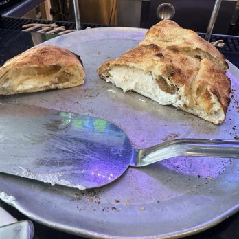 Grimaldi's Pizzeria - "Eggplant" calzone $4 extra for the eggplant, you gotta look really hard to find that little sliver. - Pizza Near Me - Garden City, New York