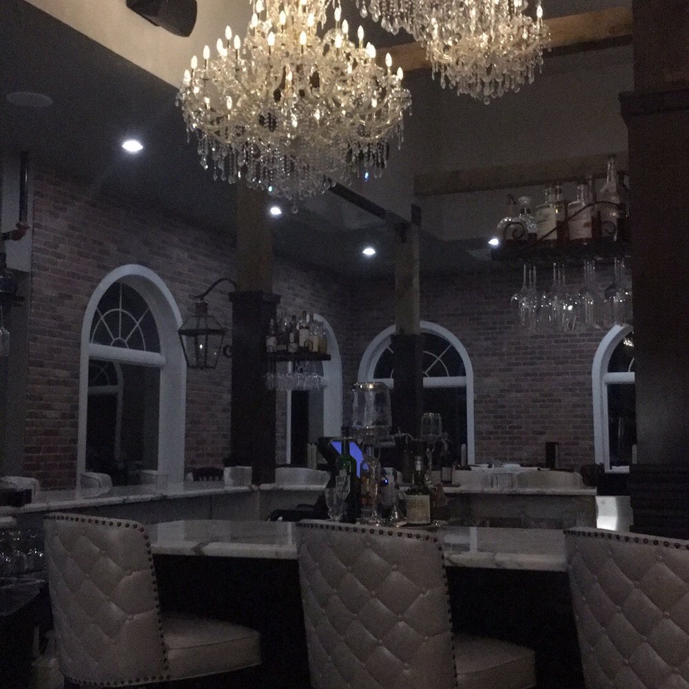 Marais - Beautiful lighting over one of the bars. - Seafood Near Me - Dickinson, Texas Marais - Beautiful lighting over one of the bars. - Seafood Near Me - Dickinson, Texas