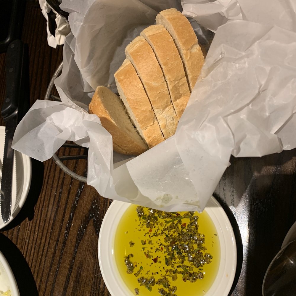 Carrabba's Italian Grill - Fresh warm bread with olive oil - Italian Near Me - Macon, Georgia Carrabba's Italian Grill - Fresh warm bread with olive oil - Italian Near Me - Macon, Georgia