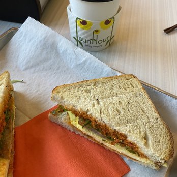 Sunflour Baking Company - #5 Breakfast sandwich- arugula, sun dried tomato paste, egg and sausage and pumpkin spice latte - Bakeries Near Me - Charlotte, North Carolina Sunflour Baking Company - #5 Breakfast sandwich- arugula, sun dried tomato paste, egg and sausage and pumpkin spice latte - Bakeries Near Me - Charlotte, North Carolina