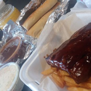 Wing Legends - Barbecue baby back ribs on a bed of fries with sides of potato salad baked beans and breadsticks - Chicken Wings Near Me - San Diego, California Wing Legends - Barbecue baby back ribs on a bed of fries with sides of potato salad baked beans and breadsticks - Chicken Wings Near Me - San Diego, California
